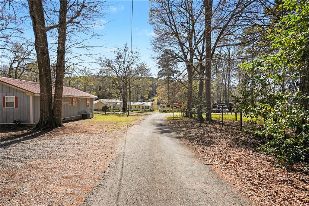 267 Macon Street Monticello, GA 31064 - Photo 25 of 28 a view of road with large trees