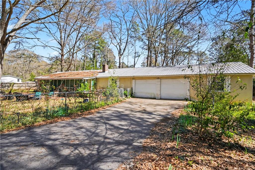 267 Macon Street Monticello, GA 31064 - Photo 28 of 28 a front view of a house with a garden