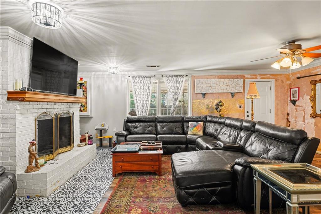 267 Macon Street Monticello, GA 31064 - Photo 3 of 28 a living room with furniture fireplace and flat screen tv