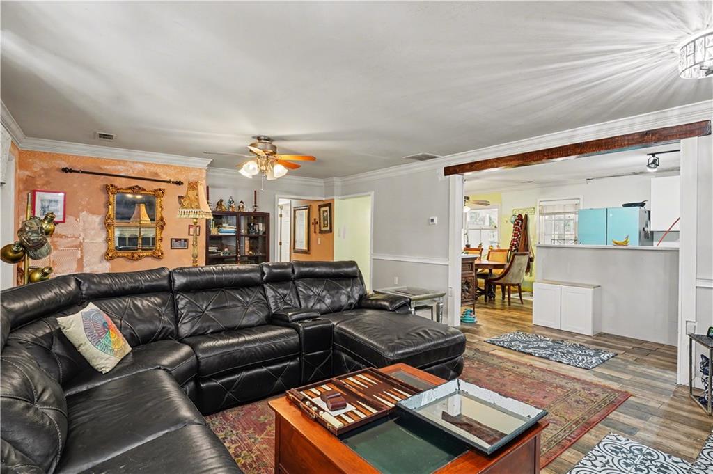 267 Macon Street Monticello, GA 31064 - Photo 4 of 28 a living room with furniture and wooden floor