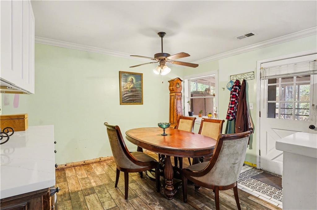 267 Macon Street Monticello, GA 31064 - Photo 9 of 28 a dining room with furniture and window