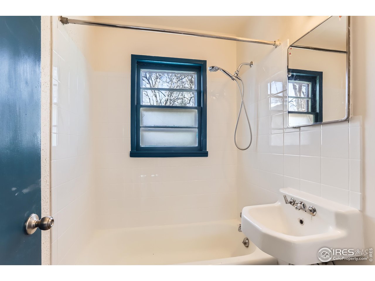 315 29th Street Boulder, CO 80305 - Photo 17 of 29 a bathroom with a sink and a mirror
