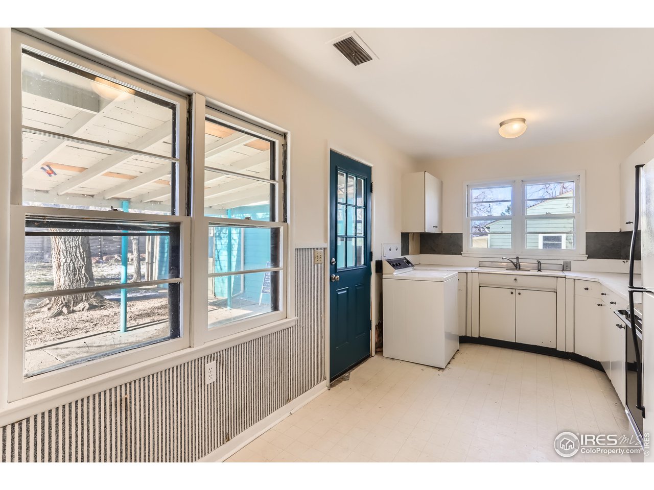 315 29th Street Boulder, CO 80305 - Photo 8 of 29 a kitchen that has a lot of white cabinets and wooden floor
