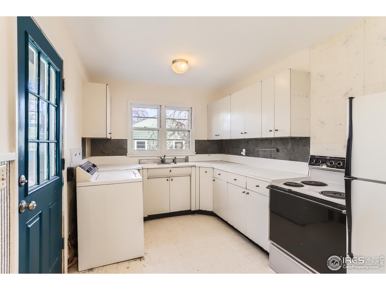 315 29th Street Boulder, CO 80305 - Photo 9 of 29 a kitchen that has a sink and a stove top oven