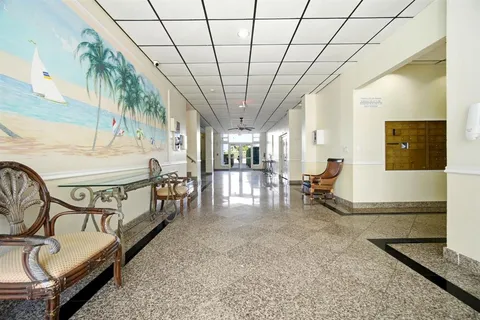 a view of swimming pool with outdoor seating and plants
