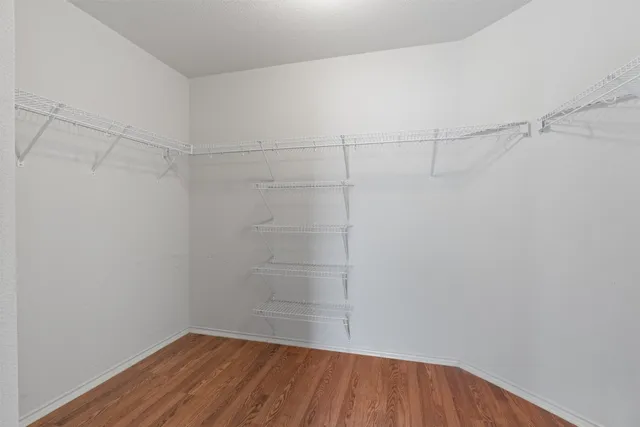 a bathroom with a sink a toilet and shower curtain