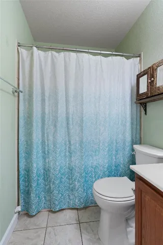 a view of a chair and table in the backyard