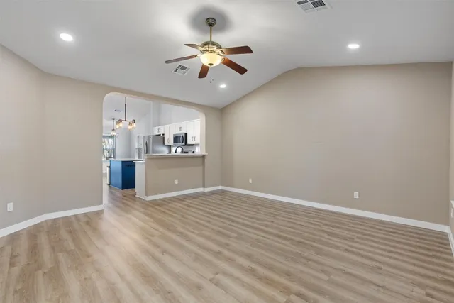 a view of a kitchen from the hallway