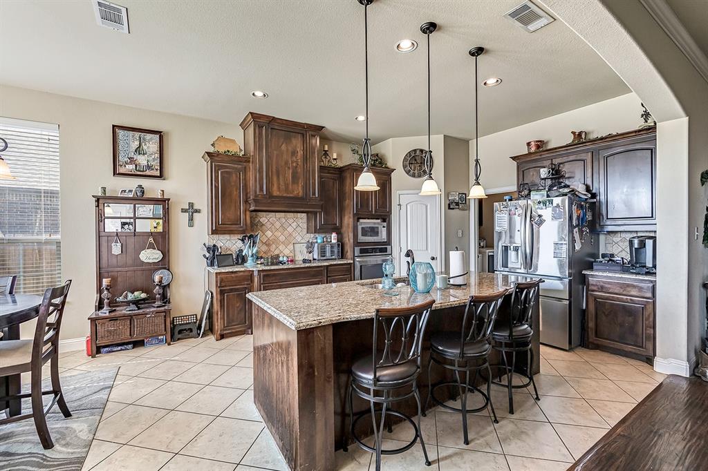3206 Meadow Ridge Drive Midlothian, TX 76065 - Photo 5 of 37 a view of a dining room with furniture