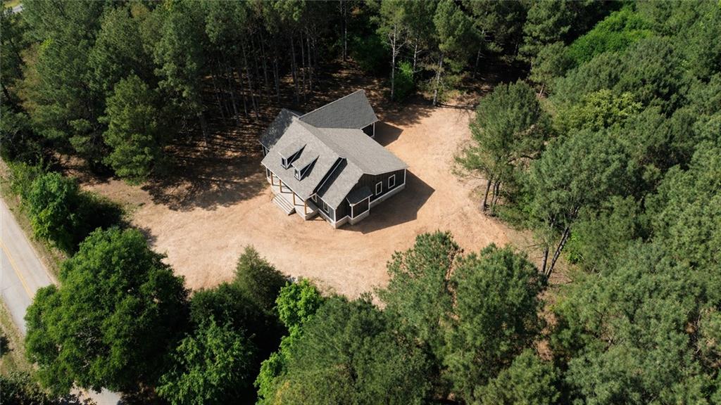 760 Frank Crook Road Canon, GA 30520 - Photo 4 of 9 an aerial view of a house with yard and lake view