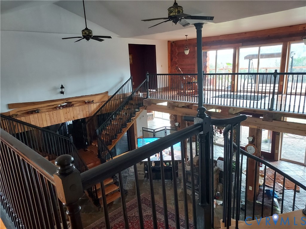 6430 River Road West Columbia, VA 23038 - Photo 12 of 48 a view of staircase with railing and white walls