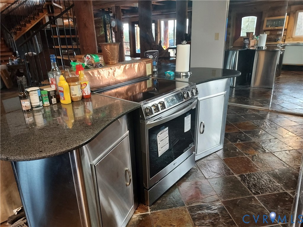 6430 River Road West Columbia, VA 23038 - Photo 16 of 48 a kitchen with stainless steel appliances granite countertop a sink a stove and a refrigerator