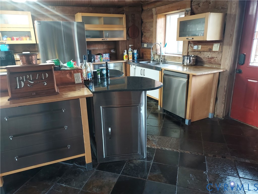 6430 River Road West Columbia, VA 23038 - Photo 17 of 48 a kitchen with stainless steel appliances granite countertop a stove and a refrigerator