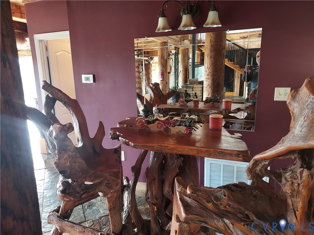 6430 River Road West Columbia, VA 23038 - Photo 22 of 48 a view of a dining room with furniture and chandelier