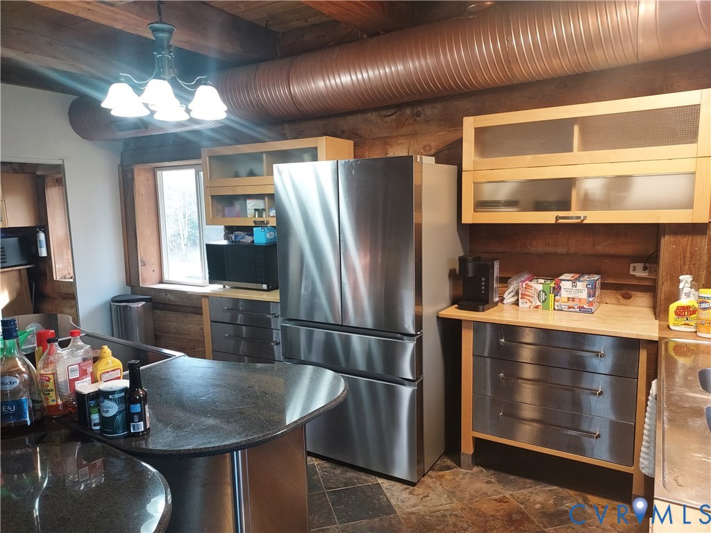 6430 River Road West Columbia, VA 23038 - Photo 27 of 48 a kitchen with refrigerator and window