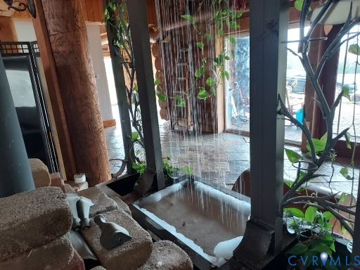 6430 River Road West Columbia, VA 23038 - Photo 34 of 48 a bathroom with a granite countertop sink and a mirror