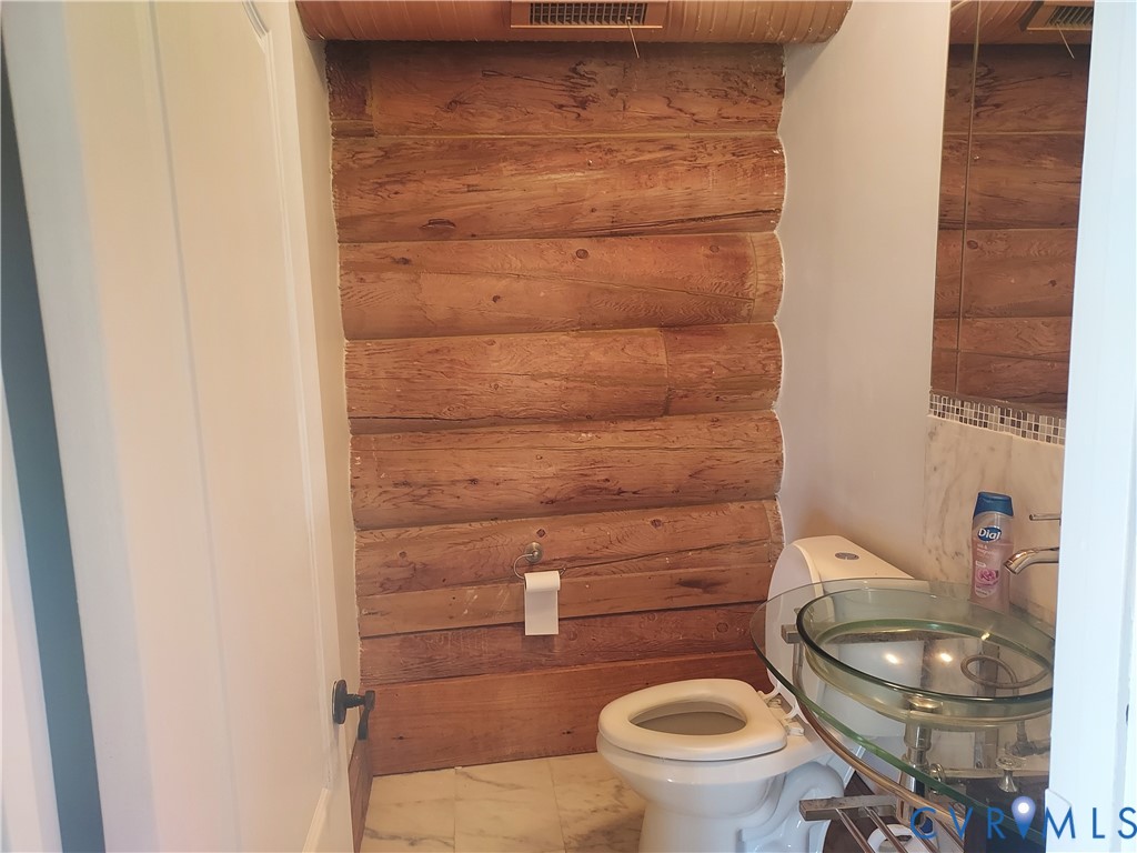 6430 River Road West Columbia, VA 23038 - Photo 39 of 48 a bathroom with a toilet and a sink