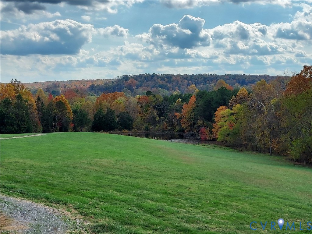 6430 River Road West Columbia, VA 23038 - Photo 10 of 48 a view of a field with mountains in the background