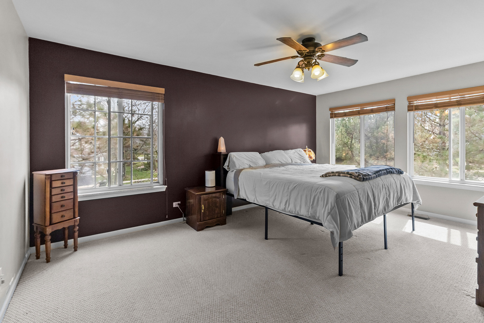 362 Keswick Circle Round Lake, IL 60073 - Photo 11 of 27 a bedroom with a bed and a chandelier