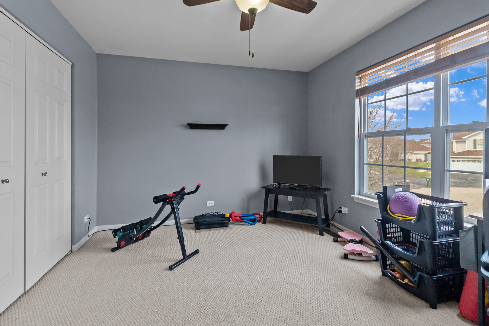 362 Keswick Circle Round Lake, IL 60073 - Photo 18 of 27 a room with gym equipment and a window