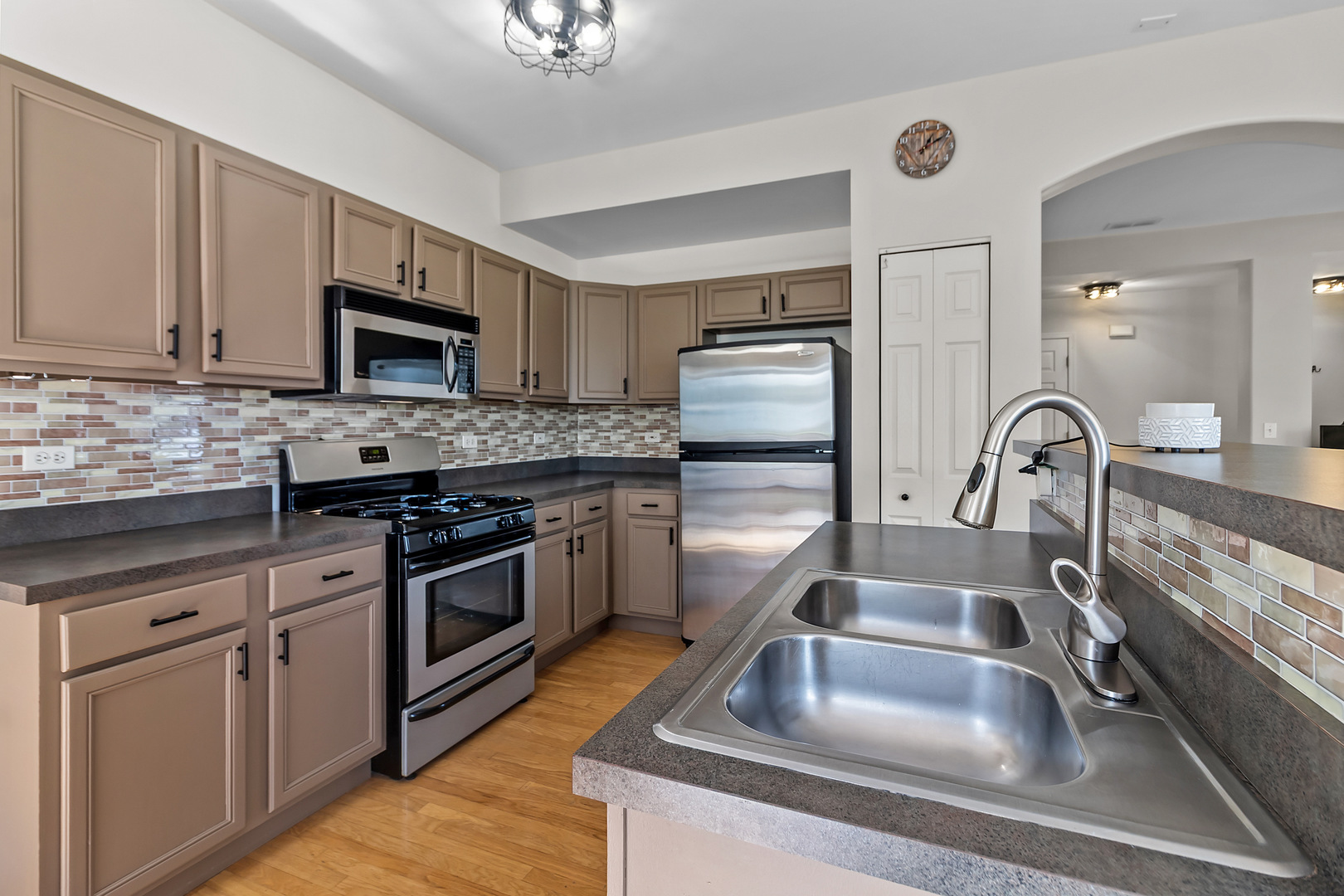 362 Keswick Circle Round Lake, IL 60073 - Photo 10 of 27 a kitchen with kitchen island a sink appliances and cabinets