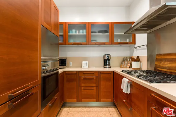 a kitchen with stainless steel appliances granite countertop a stove and a sink