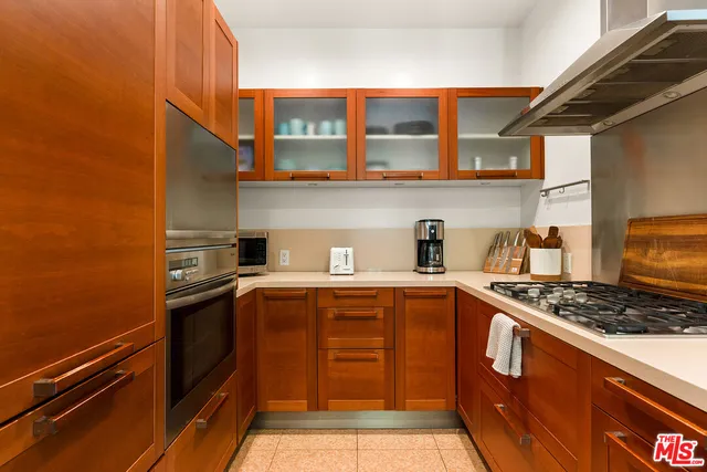 a kitchen with stainless steel appliances granite countertop a stove and a sink