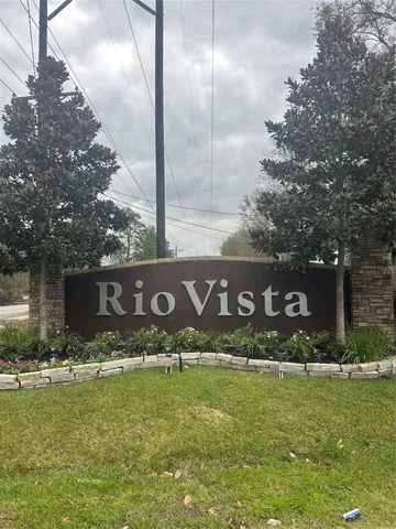 a street sign that is sitting in the grass