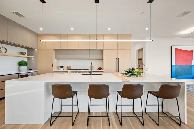 a kitchen with a dining table and chairs