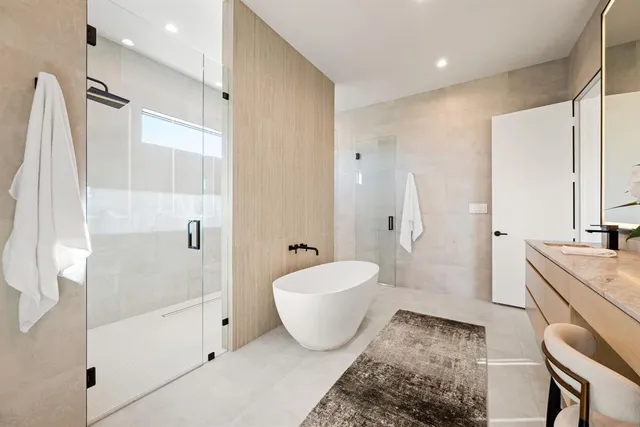 a room with walk in closet and empty racks