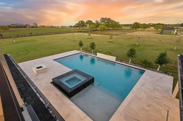 a view of a swimming pool with a porch