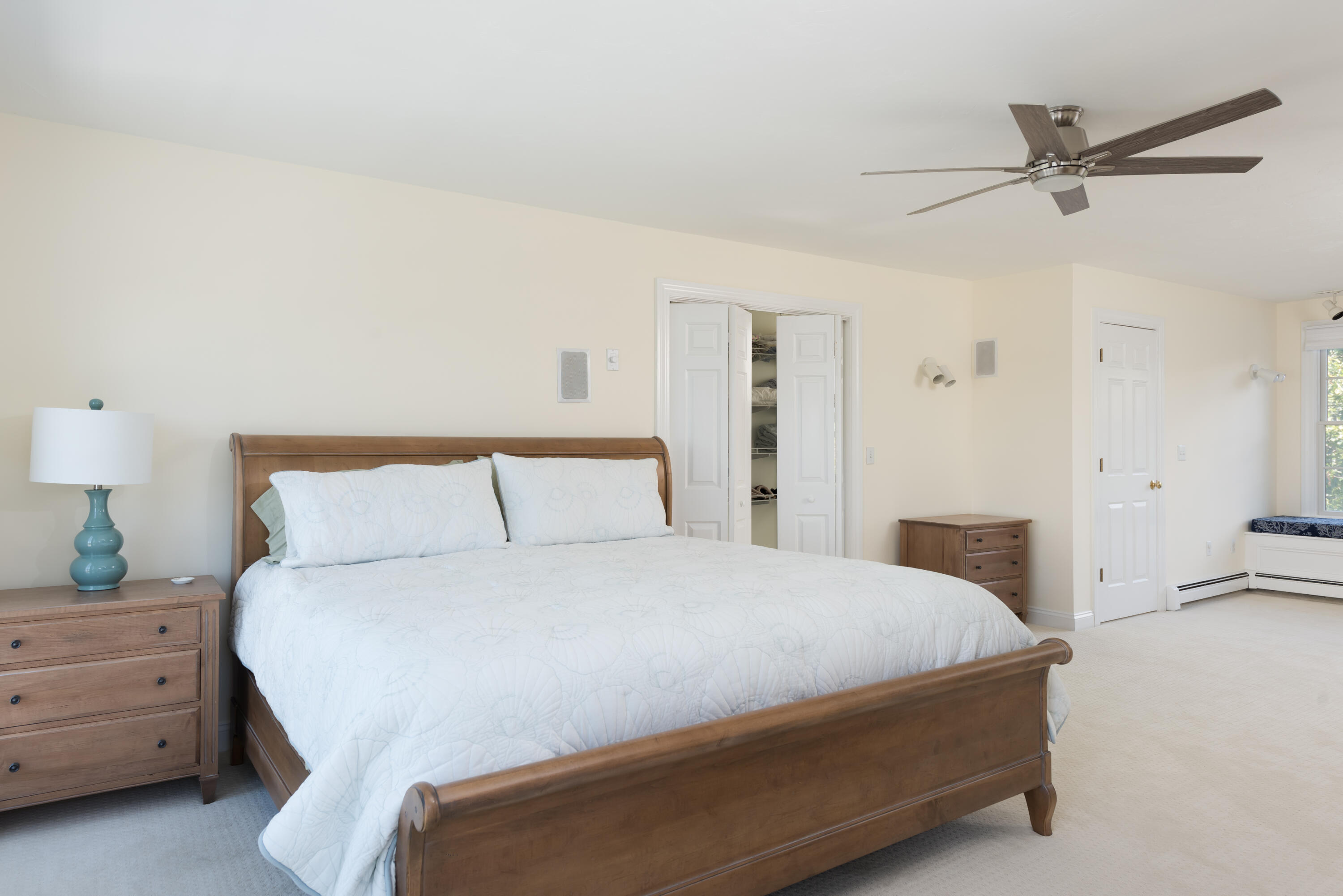 51 Robinwood Road Buzzards Bay, MA 02532 - Photo 19 of 27 a bedroom with a bed and a chandelier