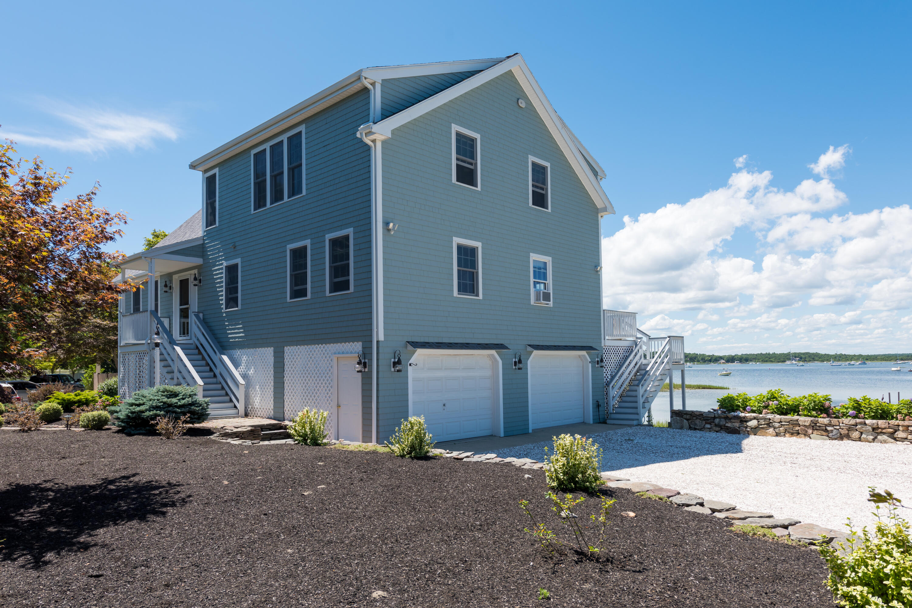 51 Robinwood Road Buzzards Bay, MA 02532 - Photo 3 of 27 a front view of a house with a yard