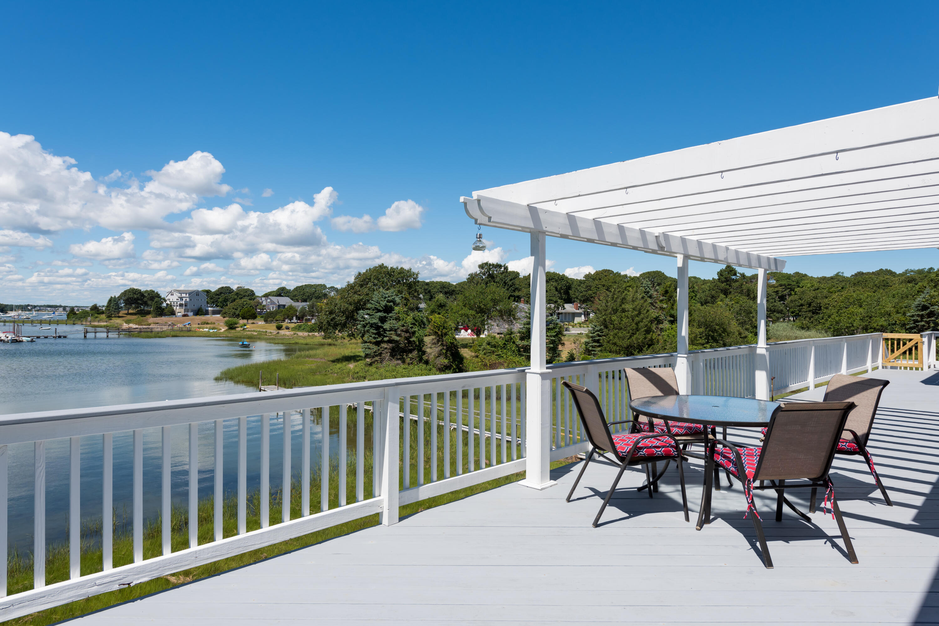 51 Robinwood Road Buzzards Bay, MA 02532 - Photo 9 of 27 a view of a chairs and table in the balcony