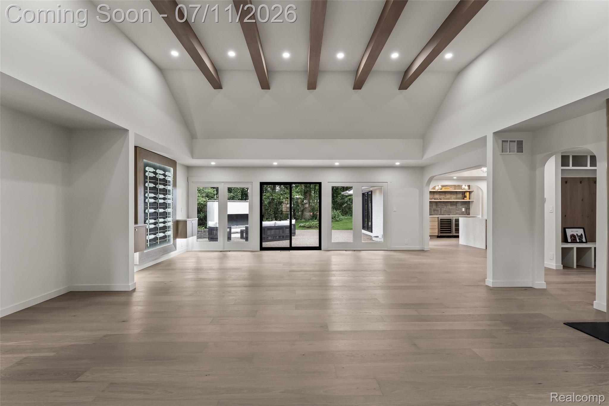 4154 Nearbrook Road Bloomfield Hills, MI 48302 - Photo 11 of 47 Spacious interior featuring a vaulted ceiling with exposed wooden beams and recessed lighting