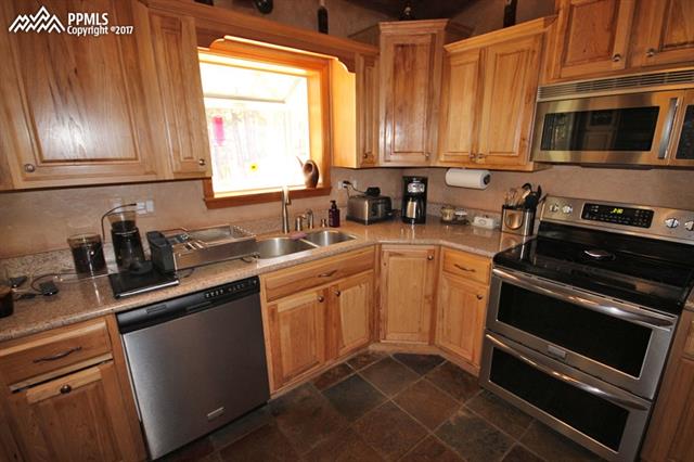 3415 Arena Road Colorado Springs, CO 80921 - Photo 10 of 36 New Hickory Cabinets with Matching Stainless Steel Appliances
