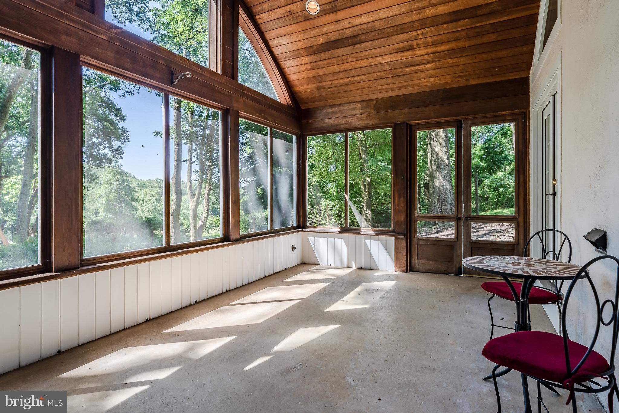 2261 Grubbs Mill Road Berwyn, PA 19312 - Photo 19 of 46 screened in porch overlooking the pond