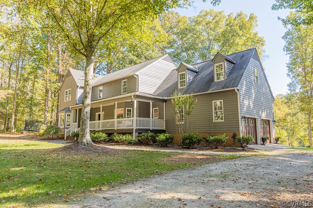 2090 Strawberry Run Crozier, VA 23039 - Photo 2 of 47 a view of a yard in front of a brick house