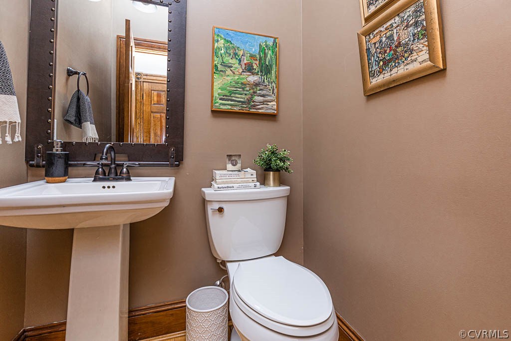 2090 Strawberry Run Crozier, VA 23039 - Photo 25 of 47 a bathroom with a toilet a sink and a mirror