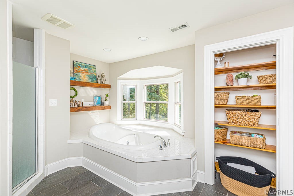2090 Strawberry Run Crozier, VA 23039 - Photo 30 of 47 a white bath tub sitting next to a window