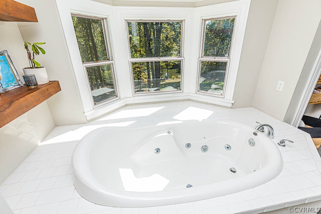 2090 Strawberry Run Crozier, VA 23039 - Photo 32 of 47 a white tub sitting in a bathroom next to a window