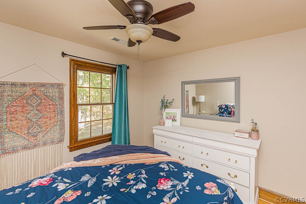 2090 Strawberry Run Crozier, VA 23039 - Photo 36 of 47 a bedroom with a bed and a chandelier