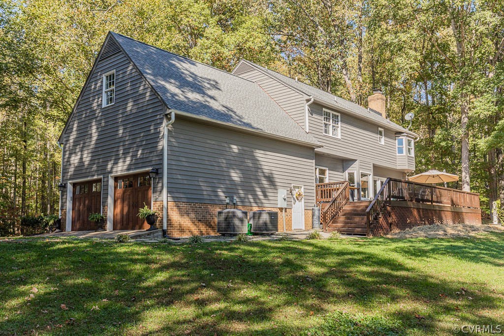 2090 Strawberry Run Crozier, VA 23039 - Photo 4 of 47 a view of a house with a yard and deck