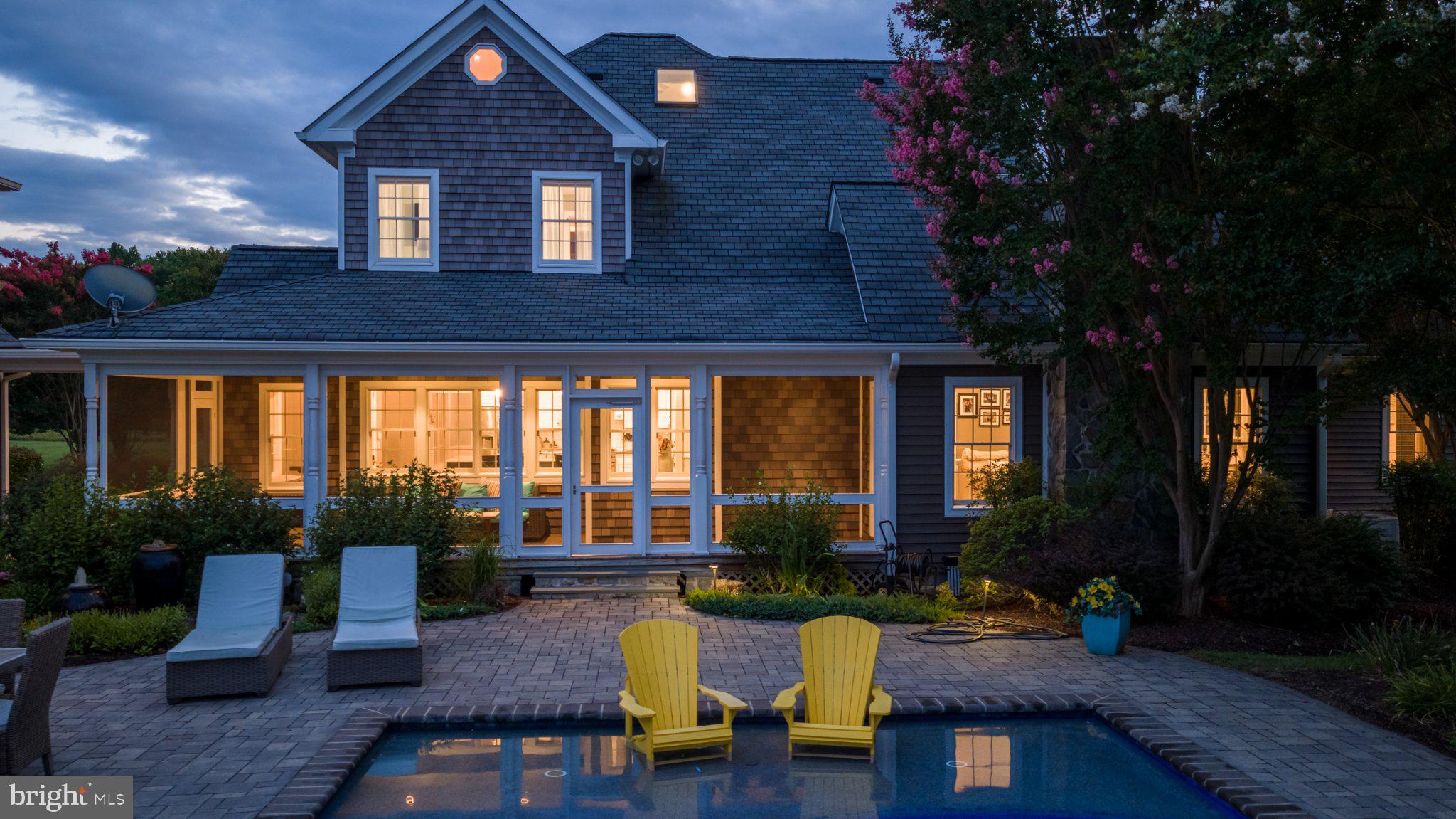 4401 Grove Road Trappe, MD 21673 - Photo 69 of 73 Charming home with inviting poolside glow.