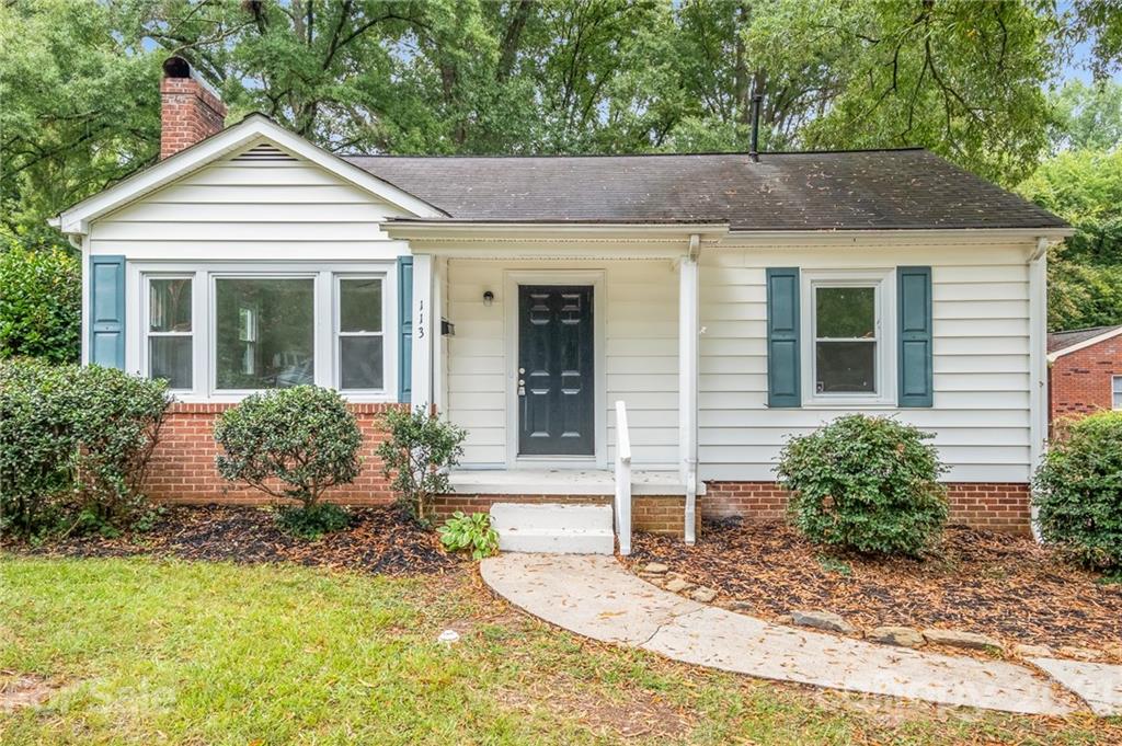 113 Hillside Avenue Southwest Concord, NC 28025 - Photo 1 of 19 front view of a house with potted plants