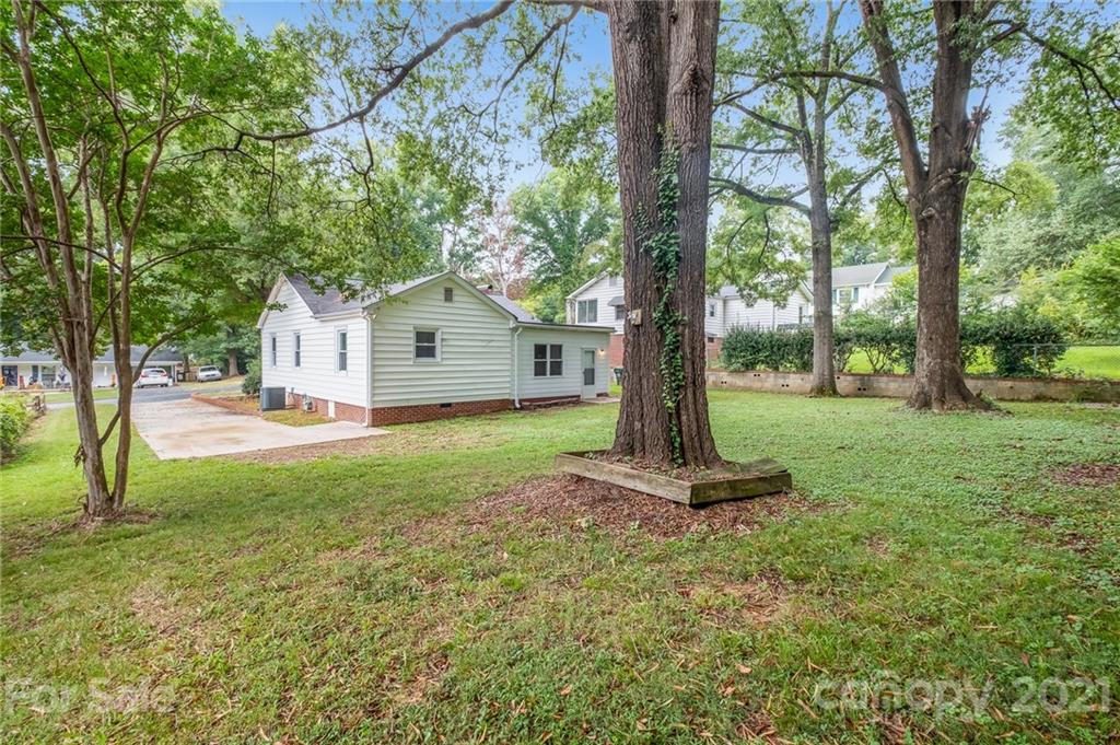 113 Hillside Avenue Southwest Concord, NC 28025 - Photo 17 of 19 a front view of a house with a yard and tree