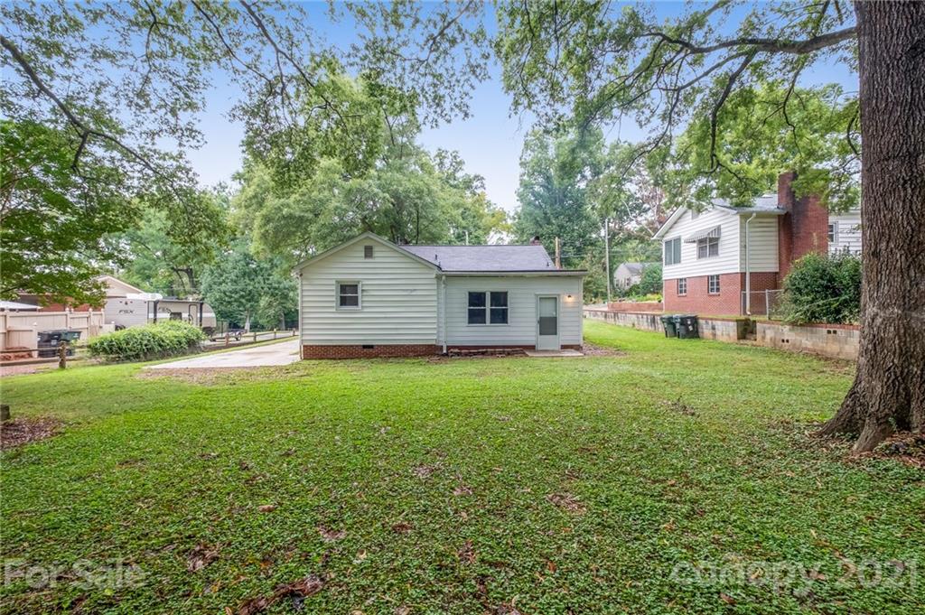 113 Hillside Avenue Southwest Concord, NC 28025 - Photo 18 of 19 a front view of house with yard and green space
