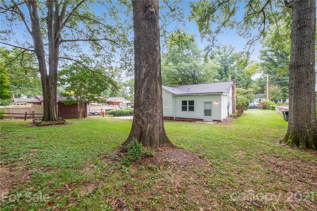 113 Hillside Avenue Southwest Concord, NC 28025 - Photo 19 of 19 a view of house with a backyard