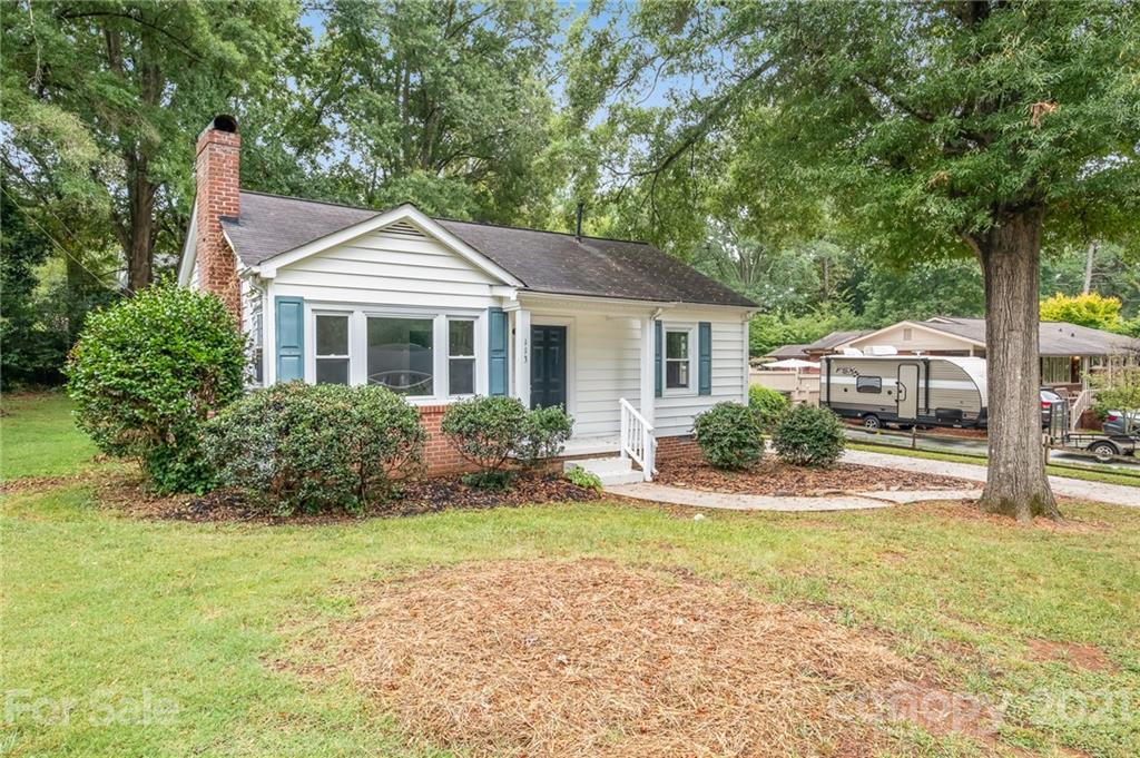 113 Hillside Avenue Southwest Concord, NC 28025 - Photo 3 of 19 a front view of a house with a yard