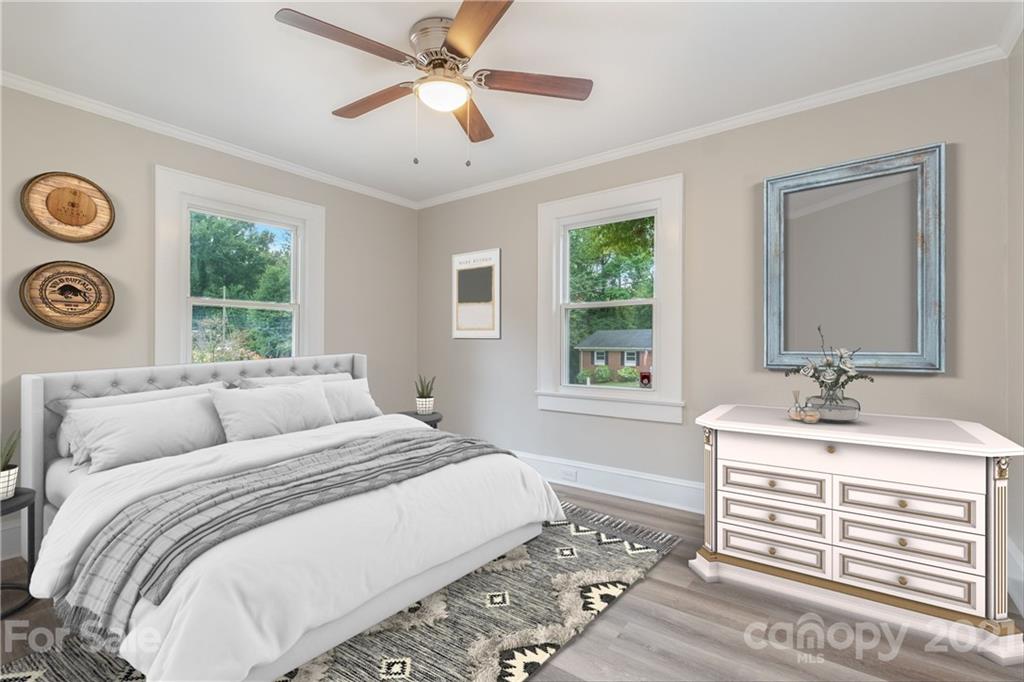 113 Hillside Avenue Southwest Concord, NC 28025 - Photo 10 of 19 a bedroom with a bed and a window